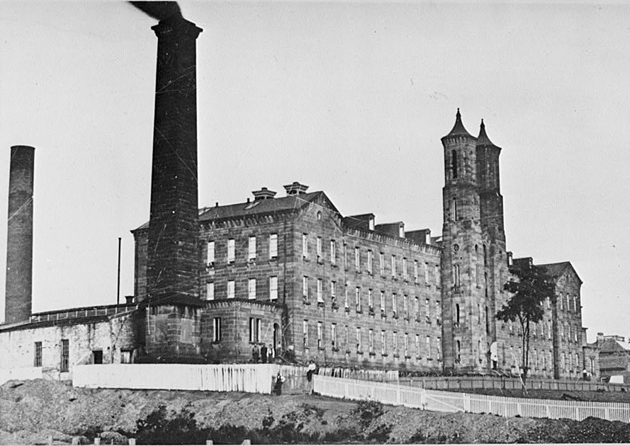 Indiana Cotton Mills, Cannelton Indiana UNDATED HISTORIC VIEW OF SQUARE AND ROUND CHIMNIES AND SOUTHWEST FACADE FROM SOUTHWEST