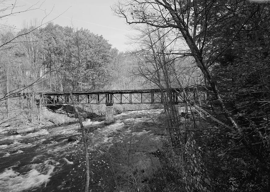 Sulphite Covered Railroad Bridge, Franklin New Hampshire 2003 NORTHEAST.  THE BRIDGE ONCE HAD VERTICAL BOARD SIDING BUT VANDALS BURNED IT OFF IN 1981