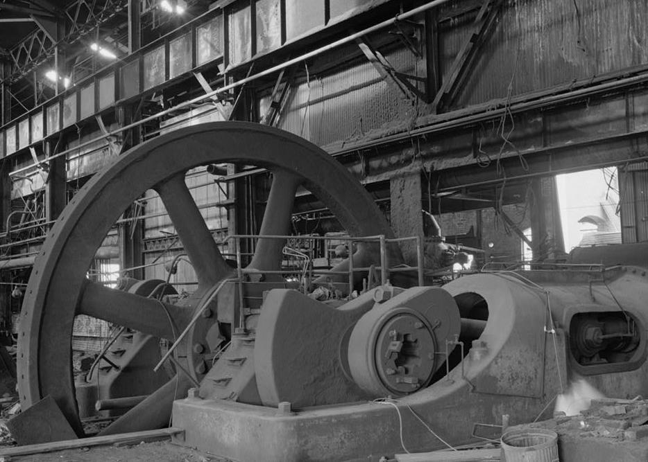 Republic Iron and Steel Company Youngstown Works, Ohio INTERIOR OF ENGINE ROOM, CONTAINING MESTA-CORLISS CROSS-COMPOUND ENGINE, FOR 40" BLOOMING MILL. THIS VIEW HIGHLIGHTS THE CRANK AND 24' DIAMETER FLYWHEEL.