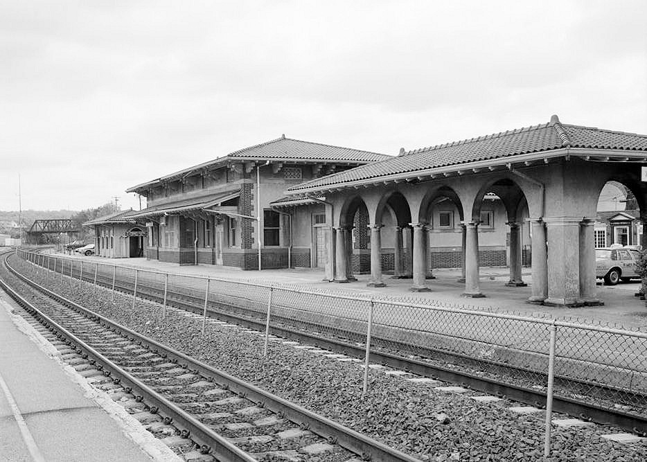1996 View of north elevation of station and east and west passenger shelters, facing southeast.