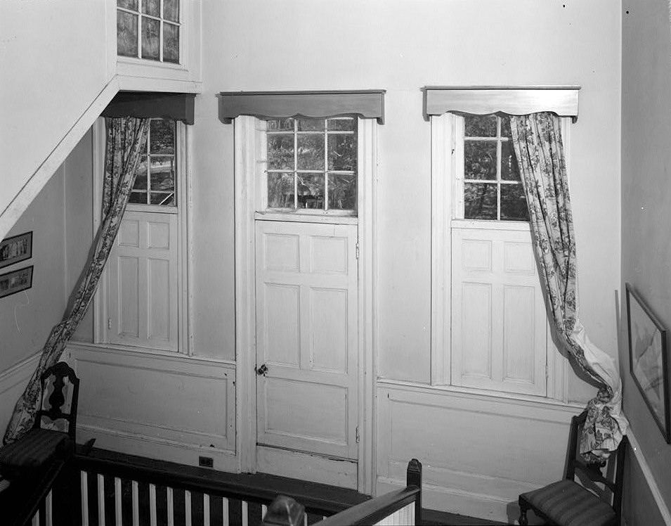 The Rocks Plantation, Eutaw Springs, South Carolina 1978 NORTH END OF HALL, SECOND FLOOR LANDING, SHOWING DOOR AND SIDE PANELS WHICH OPEN INTO SPACE UNDER NORTH SIDE CENTER PORCH AREA ROOF