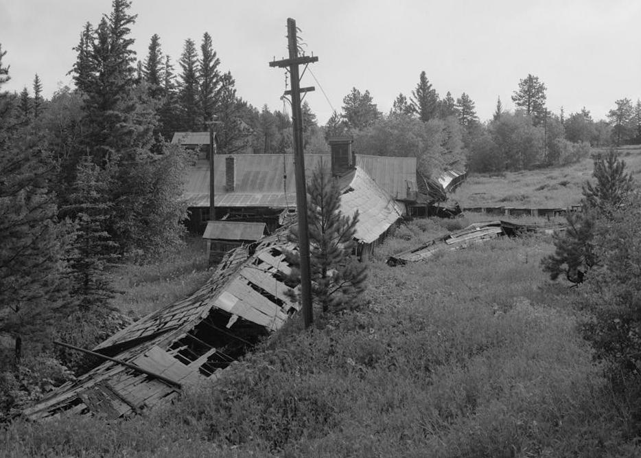 Bald Mountain Gold Mill, Lead South Dakota 1992 PORTLAND HOIST FROM SOUTHWEST. WYE TO HOISTHOUSE IN ON THE RIGHT, COMPRESSOR WING ON THE LEFT. PORTLAND MINE PORTAL ON LOWER LEFT.