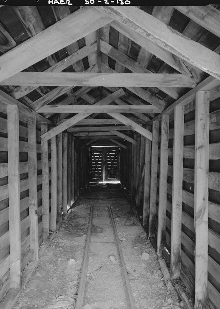Bald Mountain Gold Mill, Lead South Dakota 1992 INTERIOR, PORTLAND HOISTHOUSE. VIEW DOWN SIDE TRAM SPUR IN SNOWSHED FROM SOUTHEAST.