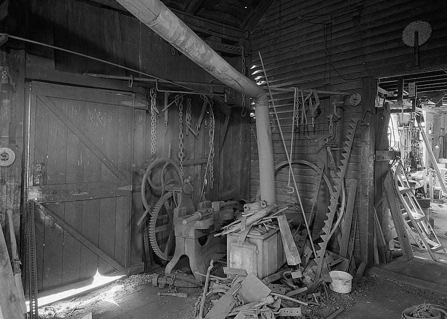 Ben Thresher's Mill, Barnet Vermont 1979 Blacksmith Shop (first floor): view looking west at heating stove and tire shrinker