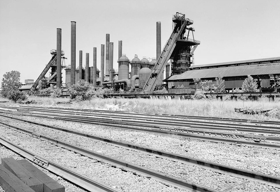 Sloss Furnace - Sloss-Sheffield Steel & Iron Company, Birmingham Alabama 1977 View looking west at central furnace complex with Southern RR mainline tracks in foreground.