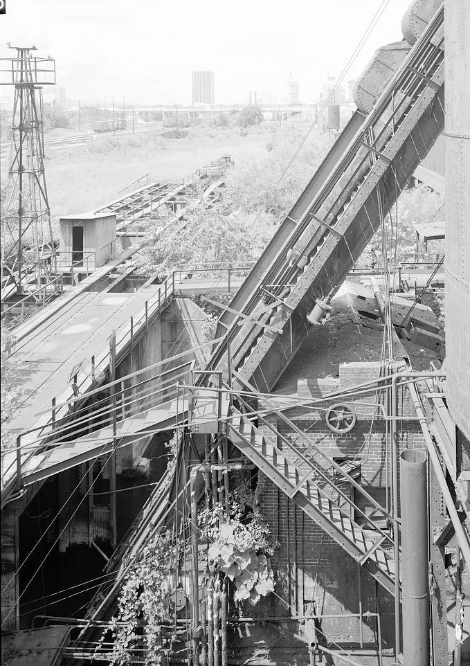 Sloss Furnace - Sloss-Sheffield Steel & Iron Company, Birmingham Alabama 1977 View from east of bottom of No. 2 Furnace skip-hoist with stock-bin trestle in background