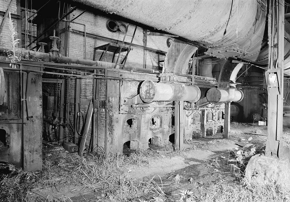 Sloss Furnace - Sloss-Sheffield Steel & Iron Company, Birmingham Alabama 1977 Base of Rust Co. boilers showing furnace gas main and boiler take-off