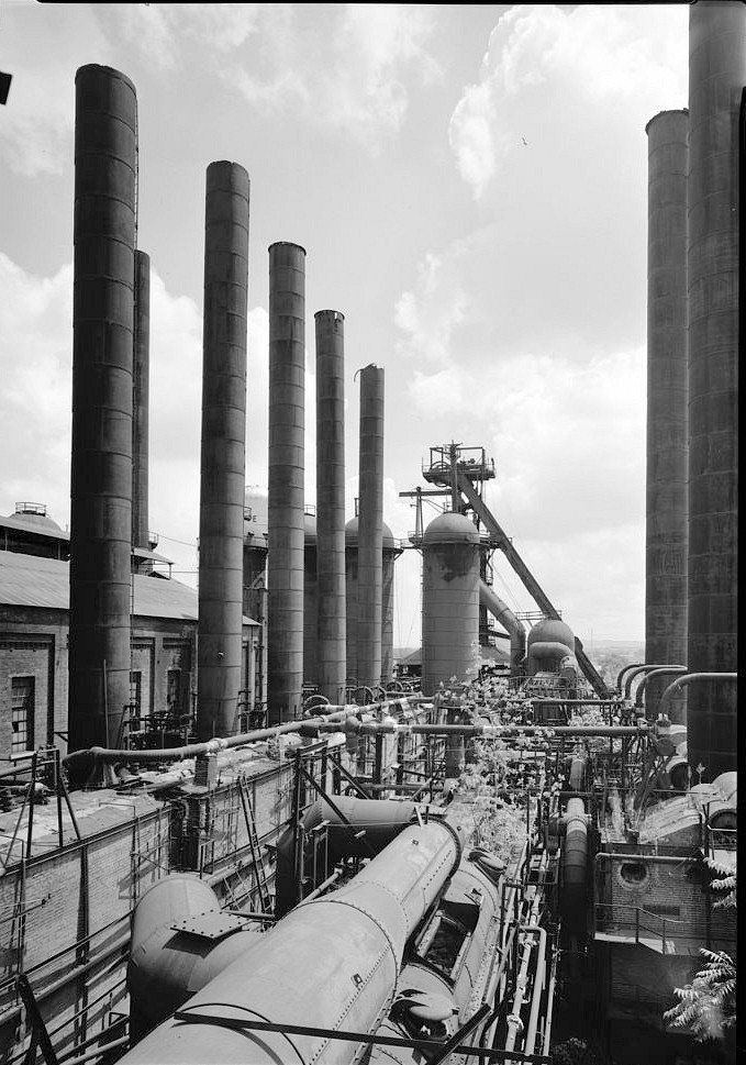 Sloss Furnace - Sloss-Sheffield Steel & Iron Company, Birmingham Alabama 1977 General view looking east showing Rust Co. boiler stacks at left, Babcock & Wilcox type boiler stacks at right, Dovel horizontal gas washer in foreground, and No. 1 Furnace in distance