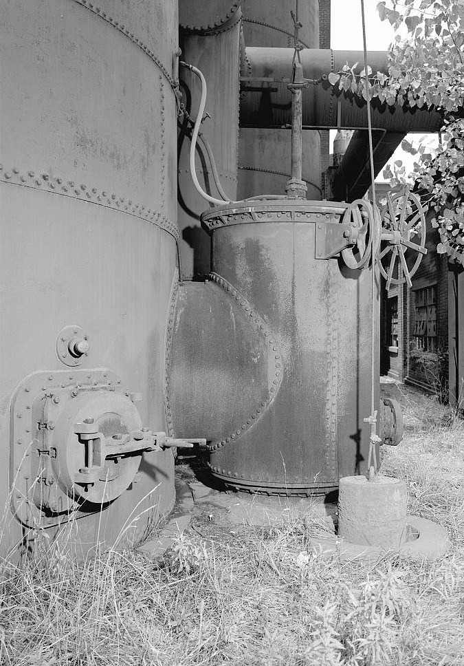 Sloss Furnace - Sloss-Sheffield Steel & Iron Company, Birmingham Alabama 1977 Cylindrical chamber where gas exits stove to below ground flue that leads to stack.