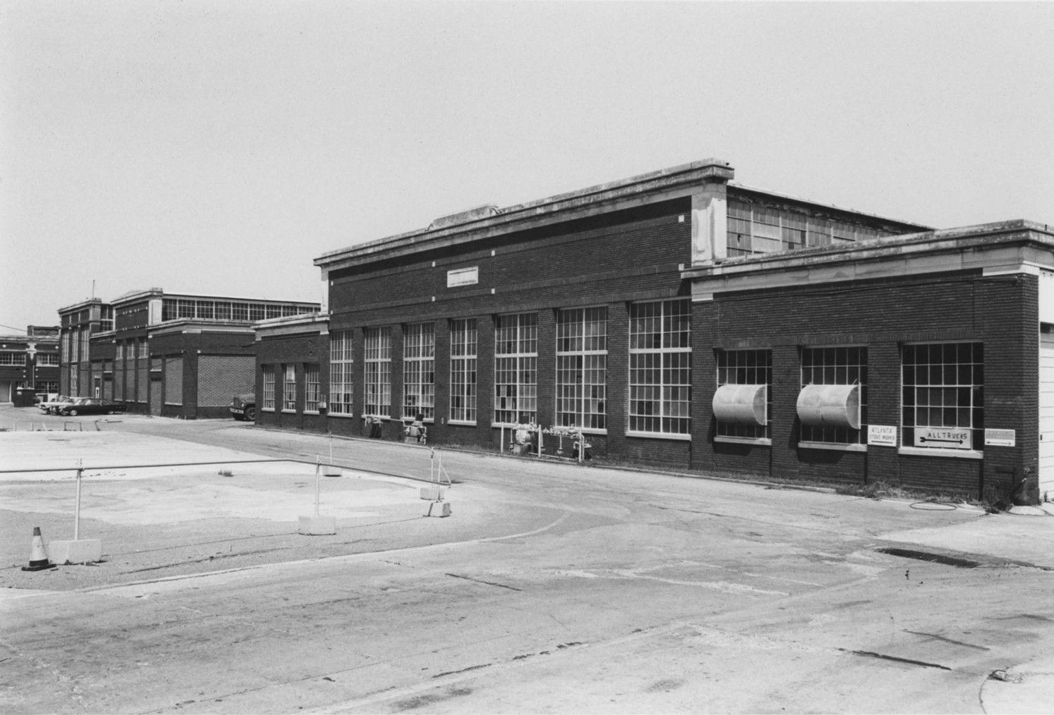 Continental Gin Company, Birmingham Alabama Machine Shops. (left) Paint Shop with Assembly Building behind (right). Note Indiana Limestone cornice work and brick inset panels and pilasters (1980)