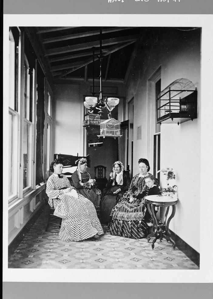 Stanford-Lathrop Mansion, Sacramento California Photocopy of 1872 photograph by Eadweard Muybridge in Stanford University Archives, PC 6. SEWING ROOM ('BIRD ROOM').LEFT TO RIGHT, ANNA MARIA LATHROP (MRS. STANFORD'S SISTER), MRS. JANE ANN (DYER) LATHROP (MRS. STANFORD'S MOTHER), ELIZABETH PHILLIPS (MRS. JOSIAH) STANFORD (GOV. STANFORD'S MOTHER), JANE LATHROP (MRS. LELAND) STANFORD AND HER SON, LELAND, JR.
