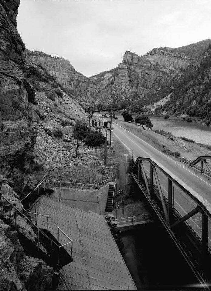 Shoshone Hydroelectric Plant Complex, Glenwood Canyon Colorado Transformer and switch rack (in center of photo on poles), looking down from the hoist house, view to the east. (Note the temporary cinnamon creek construction bridge crossing the Colorado River in the background.)