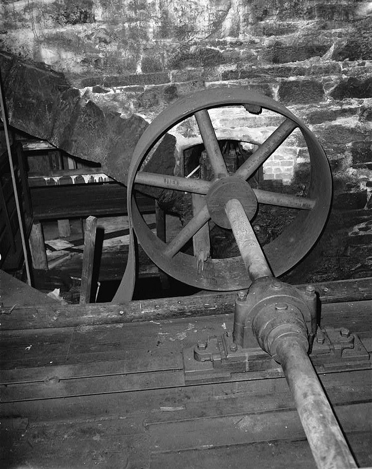 Willimantic Linen Company Mill Number 2, Windham Connecticut 1988 DETAIL VIEW NORTHEAST OF SOUTH TURBINE SHAFT AND PULLEY WHEEL