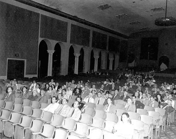 Coconut Grove Playhouse, Miami Florida 1946 photograph of the Kiehnel and Elliott-designed Coconut Grove Playhouse Auditorium, Notice the arched features along the wall with the original Solomonic columns and the molding along the roofline (1946)