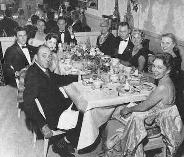 Coconut Grove Playhouse, Miami Florida George Engle, seated at the far end of the table, entertaining high society guests in the Coconut Grove Playhouse's dining room. Architect Alfred Browning Parker is seated to the far left in the photograph. 