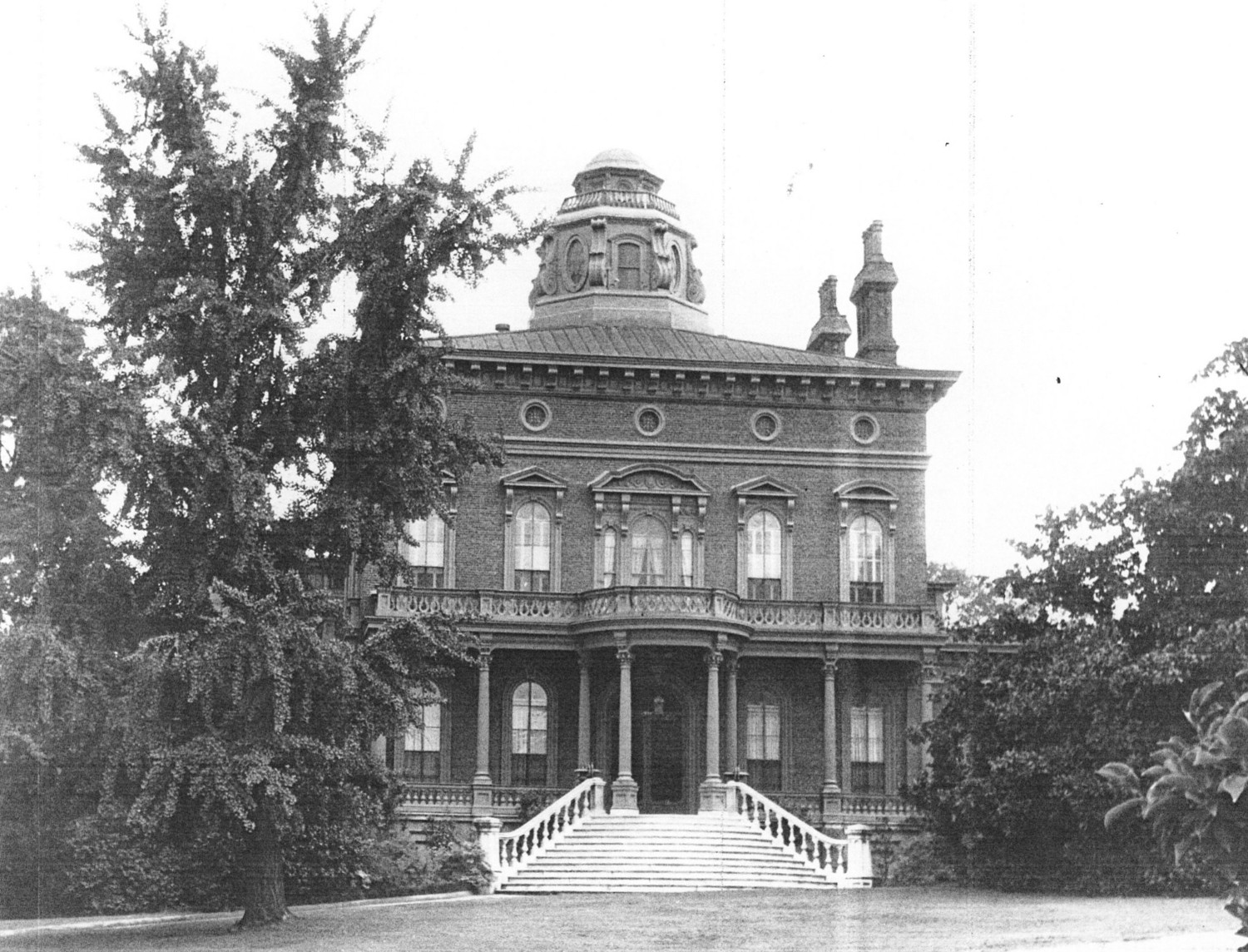 Johnston-Hay House, Macon Georgia View of front elevation showing floor length windows each opening onto a balcony or portico; also pallistrades, cornice brackets, and round window openings on third floor (1968)