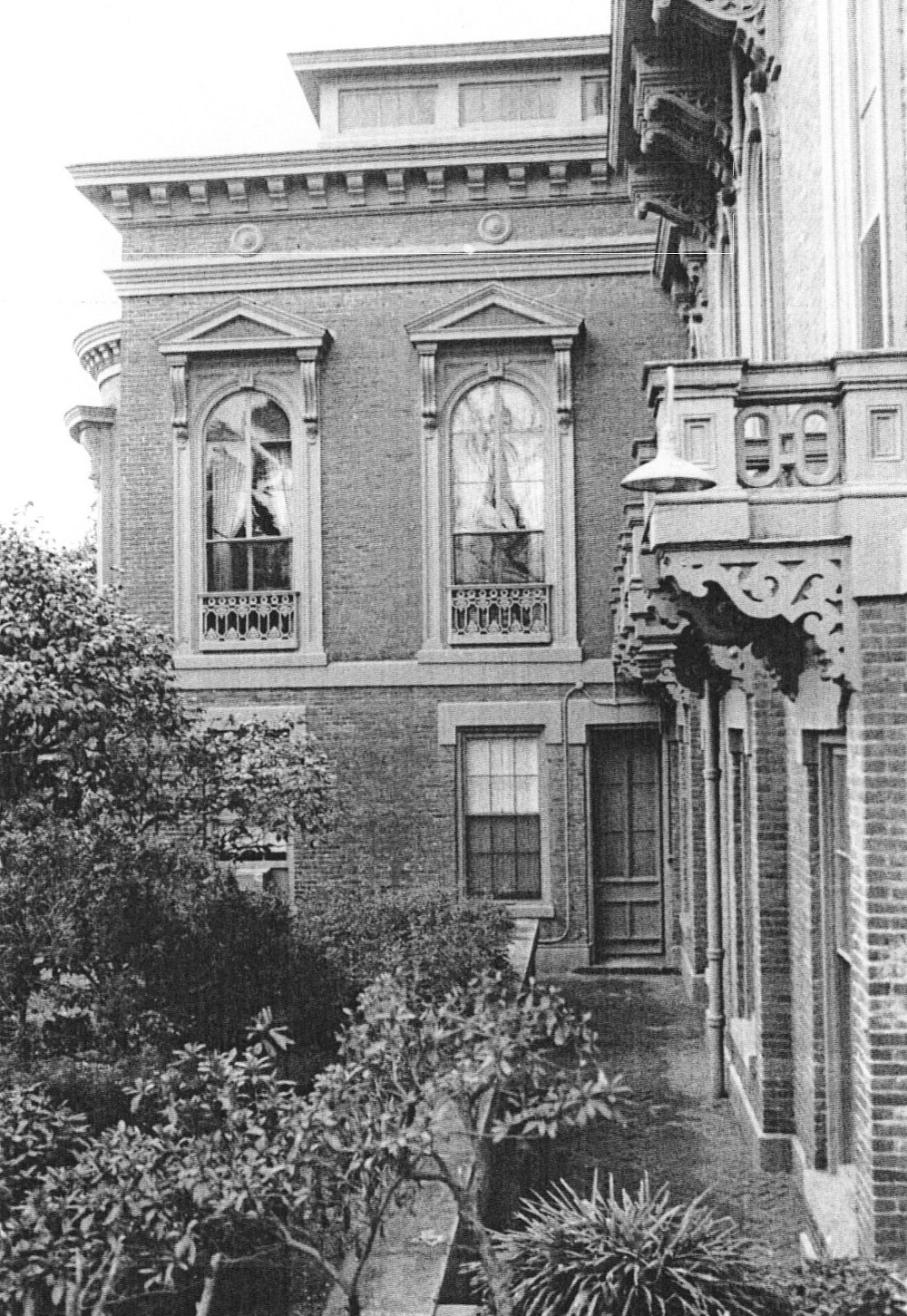 Johnston-Hay House, Macon Georgia View of east wing showing area way with details of balconies and brackets (1971)