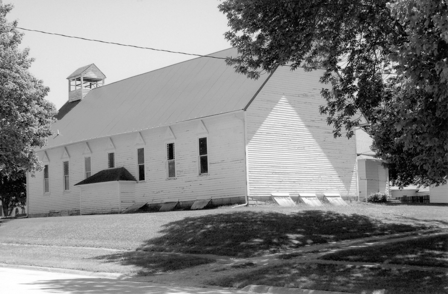 First Presbyterian Church, West Bend Iowa Rear (west) and north elevations looking to the southeast. The small addition on this elevation was constructed to house an exterior staircase into the basement (2009)