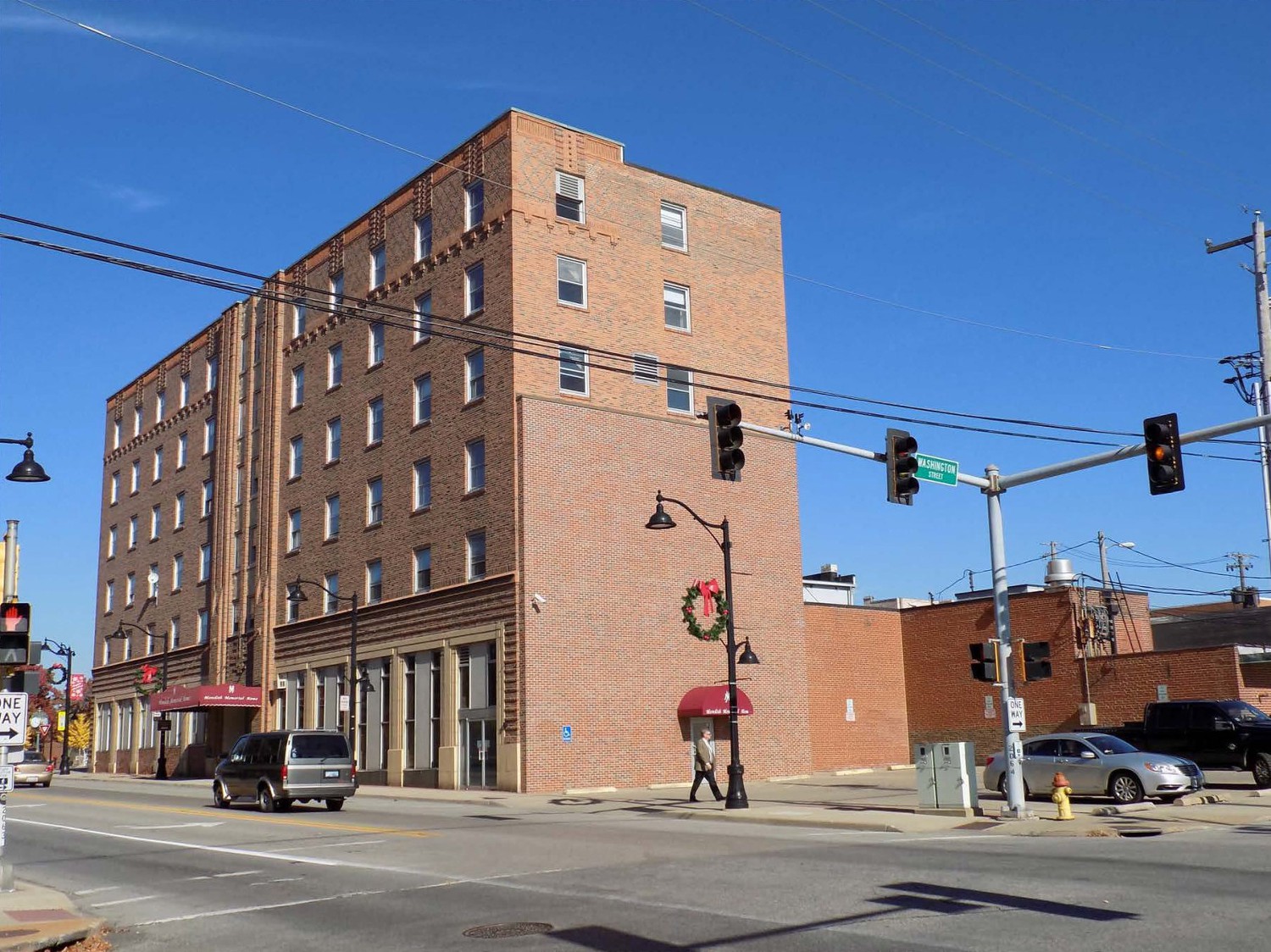 Hotel Belleville, Belleville Illinois South elevation (right) with historic and non-historic additions- visible addition in foreground is non-historic, west elevation (Primary) of hotel at left side (2017)