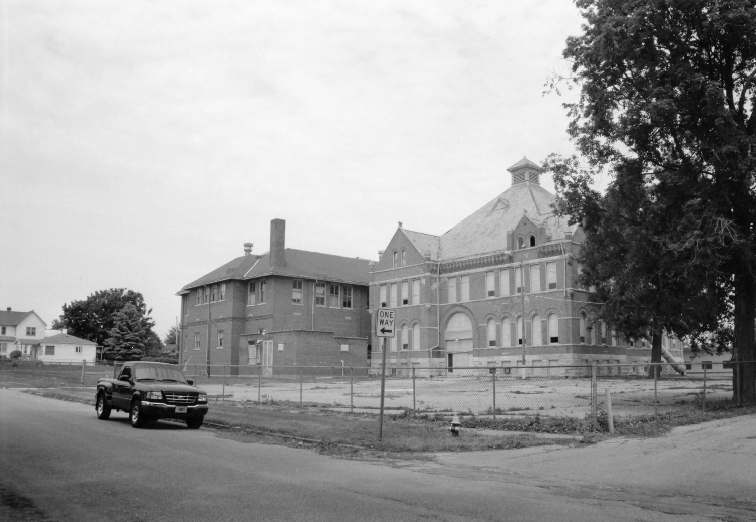 Gas City High School - East Ward School, Gas City Indiana 1894 building and 1923 addition, south and east elevations, looking northwest (2003)