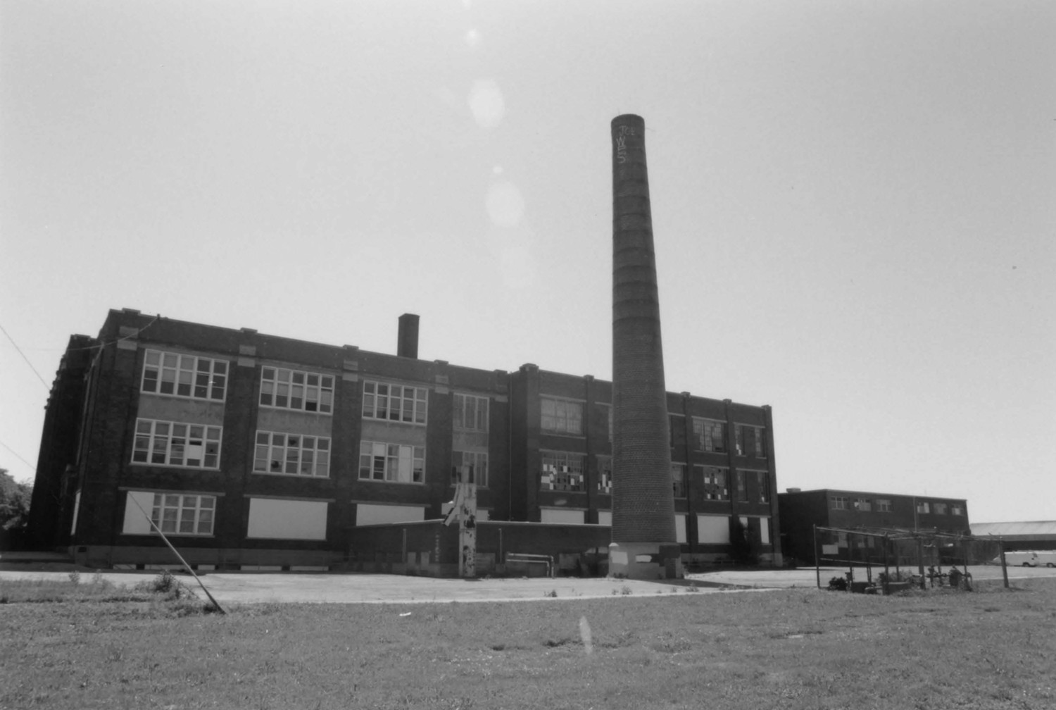 Wilson Junior High School, Muncie Indiana Rear (west) elevation. To left is 1921 block; in center are 1927 addition, boiler room and smokestack; at right is 1954 addition. Looking east from athletic fields behind school (2000)