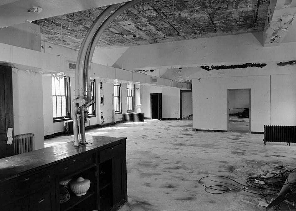 1993  The second floor. An image looking northwest into the general auditing department and the vault beyond. The cabinet has been left standing to support the two pneumatic tubes. this message center was one of the marvels of the building. It was designed and appears in the architectural drawings.