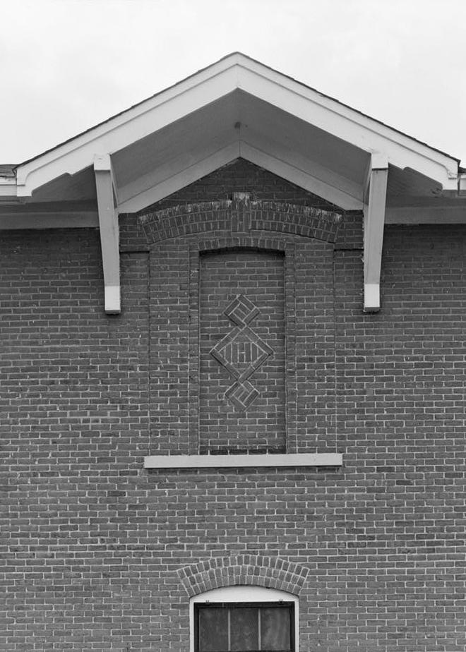 James Russell Lowell Elementary School, Louisville Kentucky 1992 SEGMENTALLY ARCHED BRICK PANEL WITH BRACKETED GABLE ON NORTH SIDE OF 1916 SECTION, TAKEN FROM THE NORTH.