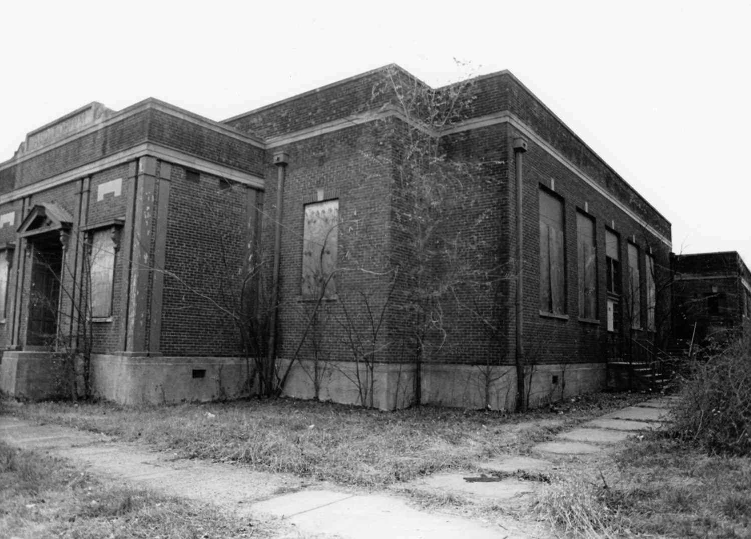 Front and north elevations of 1938 building, looking southwest