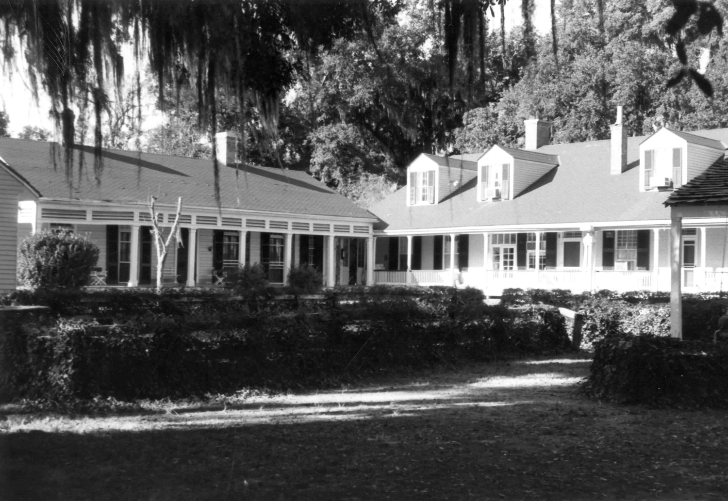 Cottage Plantation, St. Francisville Louisiana View of South side of residence and front side view of wing. Illustrates connection of the two buildings (1973)