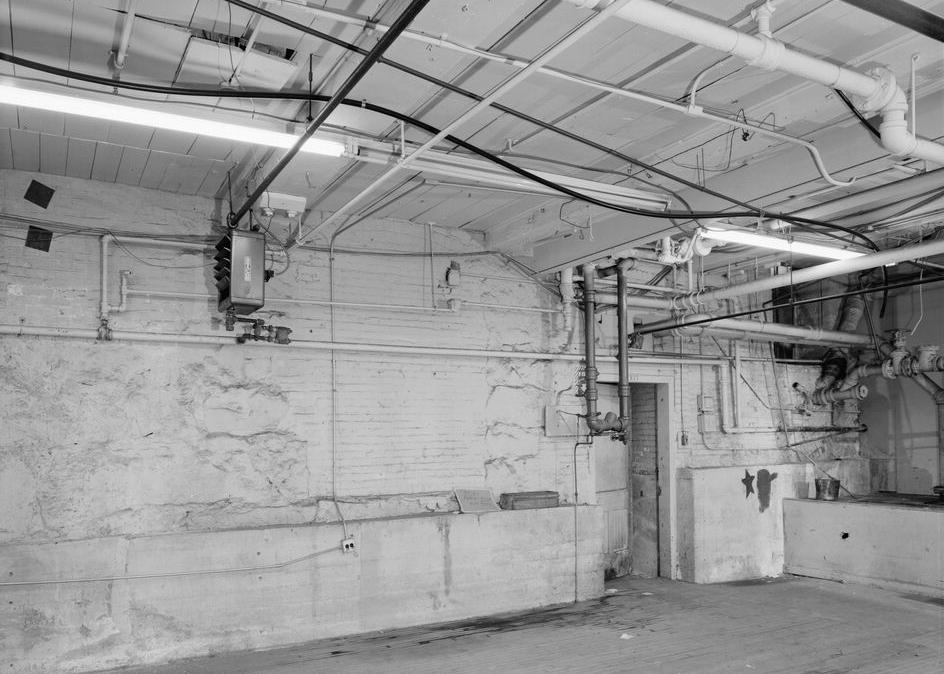 Boston Manufacturing Company, Waltham Massachusetts 1979 GROUND FLOOR VIEW OF NORTH FOUNDATION WALL AT JUNCTURE OF 1814 MILL AND 1843 CONNECTOR, WITH DOOR LEADING TO 1891 STAIR/ELEVATOR TOWER.
