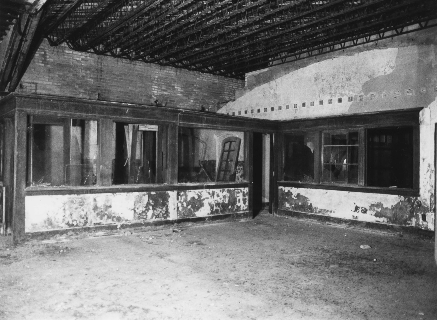 Boys Club Building, Battle Creek Michigan Lobby, looking northeast towards enclosed office area, showing original wood trim and decorative tiles in plaster walls (2001)