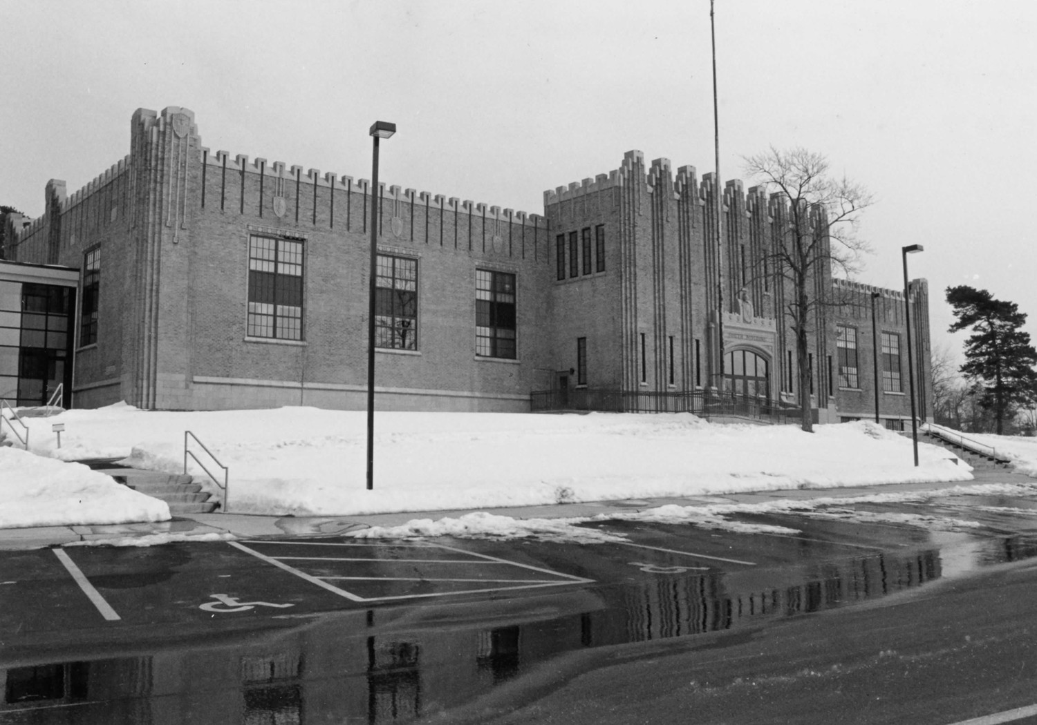 Boys Club Building, Battle Creek Michigan Building facade, looking southeast and showing new doors and windows. On the left is a glass walkway that connects to the side addition (2004)