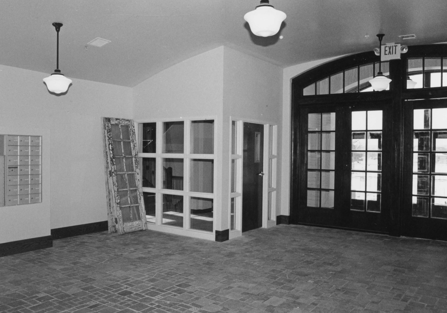 Boys Club Building, Battle Creek Michigan Interior view of lobby, looking south to stairwell and front entry. The stairwell was enclosed in 2003 to meet fire code, but the arched ceiling and exterior doors were reinstalled and historic tile flooring retained (2004)