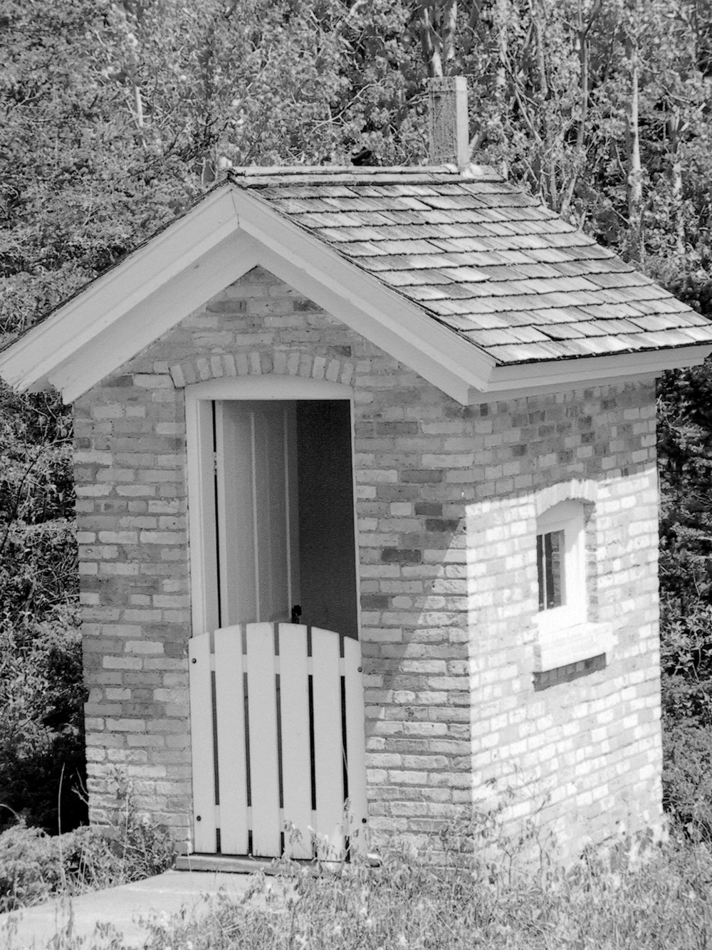 Copper Harbor Light Station, Copper Harbor Michigan 1866 privy, west elevation (left) has door & south elevation (right) has small window (2009)