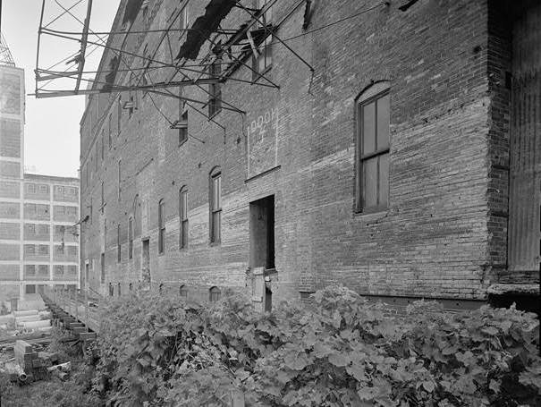 Standard Mill, Minneapolis Minnesota NORTH SIDE, SHOWING RAILROAD TRESTLE AND SECOND-FLOOR LOADING DOORS; LOOKING SOUTHEAST