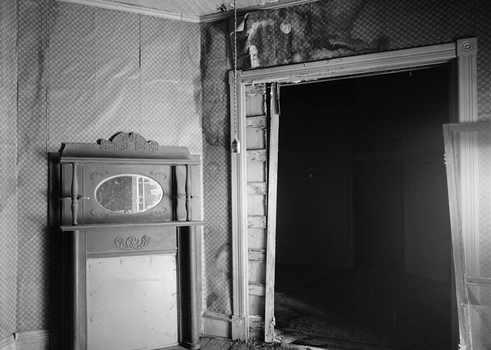 Coffeeville Hotel, Coffeeville Mississippi Looking toward east corner of room G, showing corner fireplace (1982)