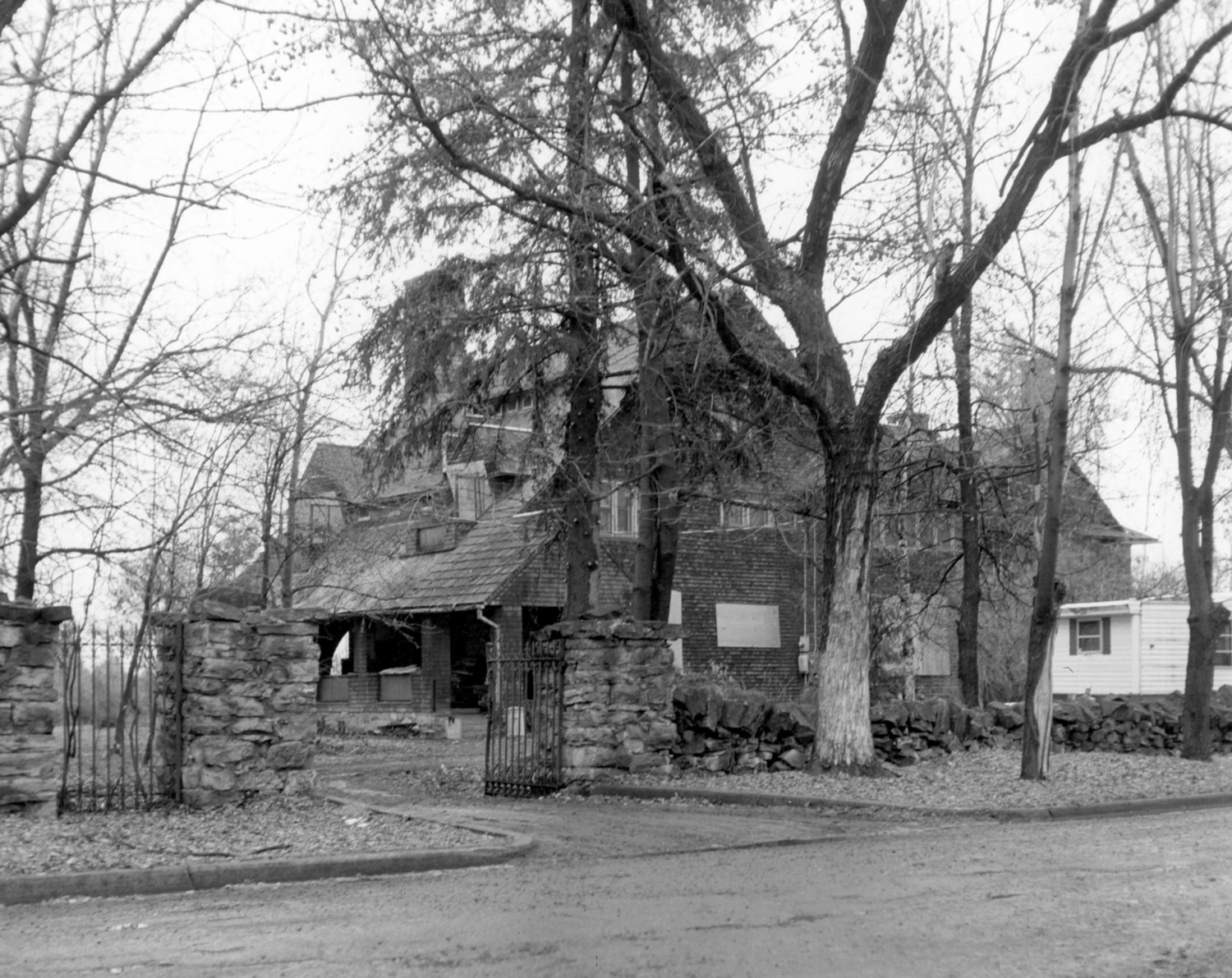 Front and west side view of Conrad Mansion. Photo taken from Sixth Avenue (1973)