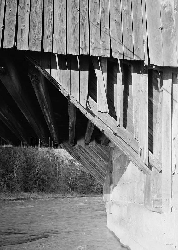Wrights Covered Bridge, Claremont New Hampshire LARGE WOODEN SKEWBACK FOR ARCH JUTTING OUT FROM GRANITE BLOCK ABUTMENT.