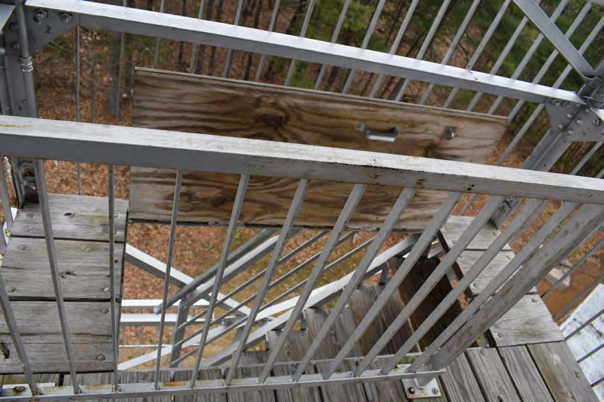 Warner Hill Fire Tower, Derry New Hampshire Intact hatch from upper platform to lower platform (2022)