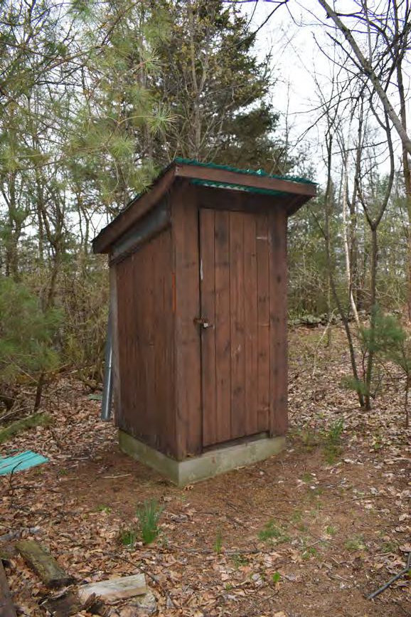 Warner Hill Fire Tower, Derry New Hampshire Outhouse southeast of telecommunication building (2022)