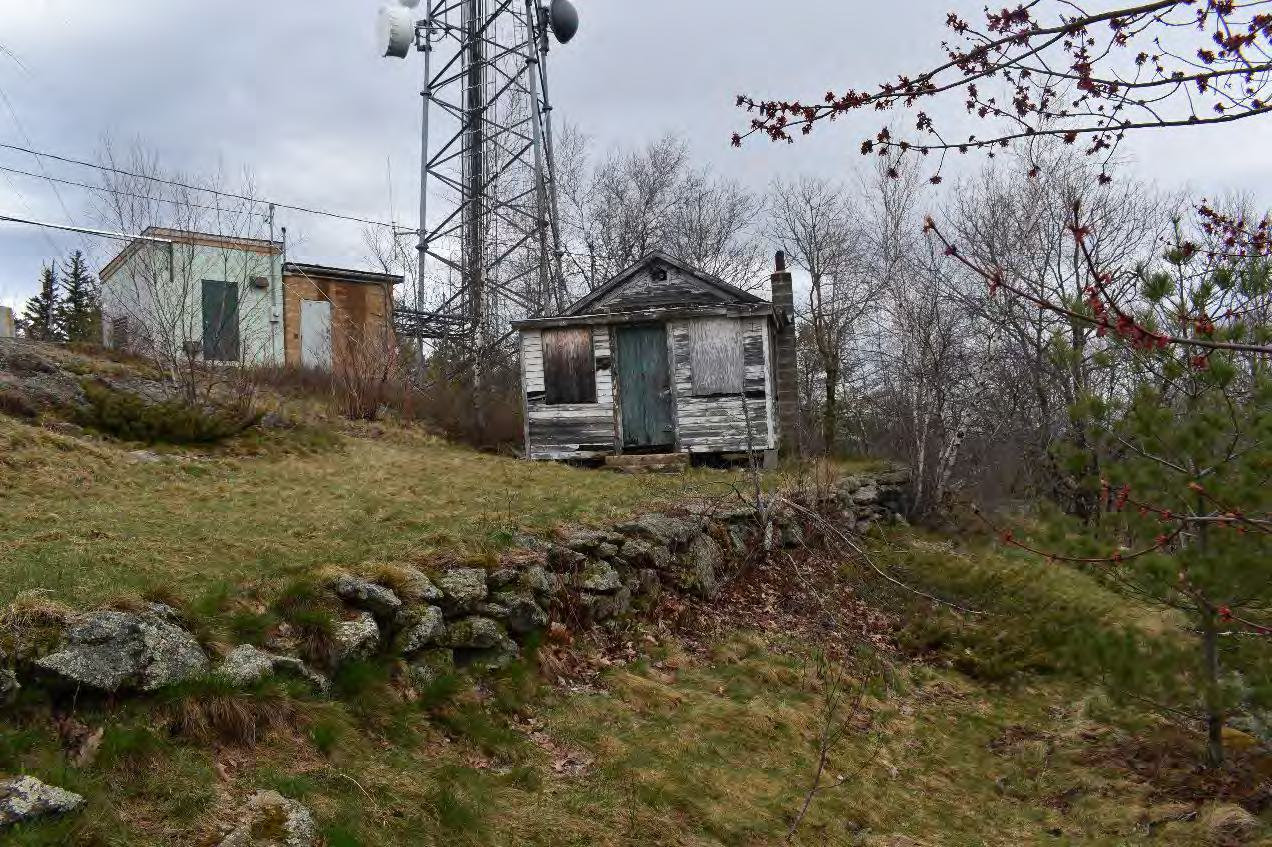 Blue Job Fire Tower, Farmington New Hampshire Retaining wall, terrace, and watchman's cabin, looking northeast from trail (2022)