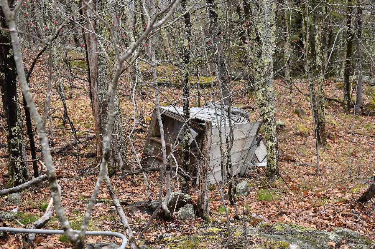 Blue Job Fire Tower, Farmington New Hampshire Outhouse downslope from its foundation (2022)