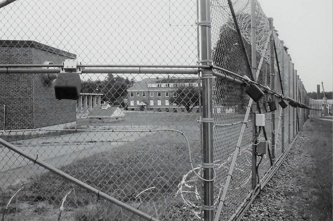 Laconia State School, Laconia New Hampshire View of chain-link fence around former prison area (2011)