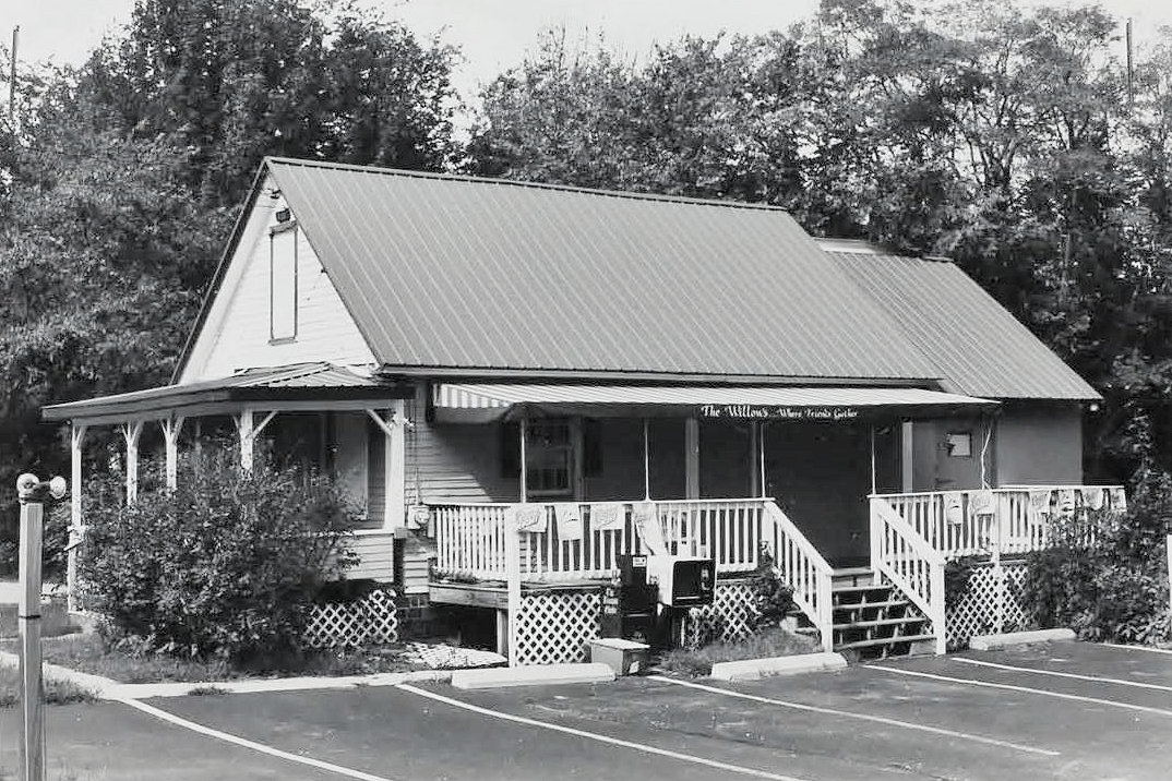 Weirs Highlands Camp and Cottages, Laconia New Hampshire Wilcomb House now a convenience store and east side parking (2006)