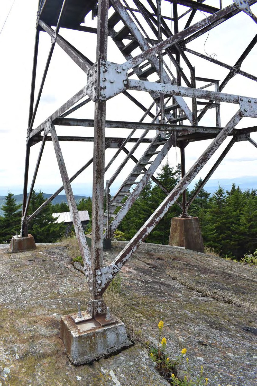 Croydon Peak Fire Tower, Newport New Hampshire Detail of fire tower piers and stairs, looking southwest (2022)