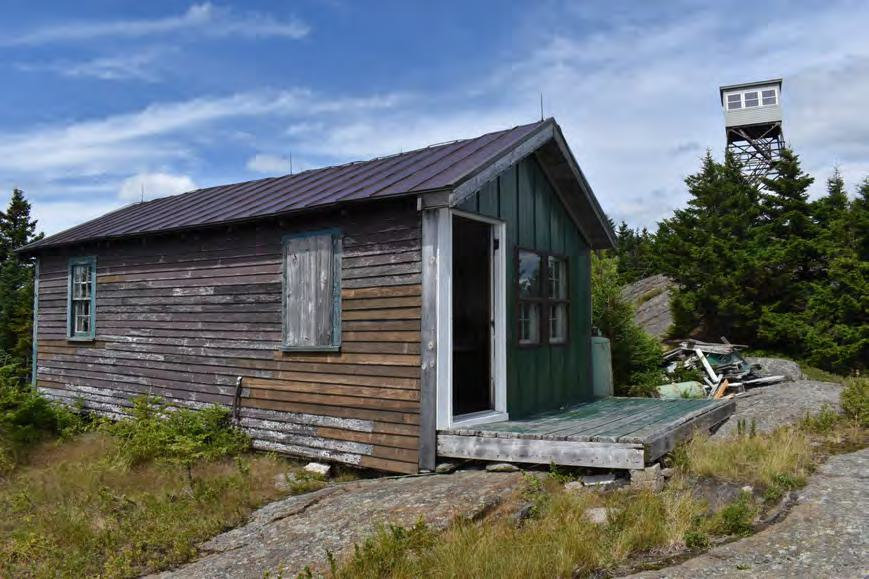Croydon Peak Fire Tower, Newport New Hampshire Watchman's Cabin with Fire Tower behind (2022)