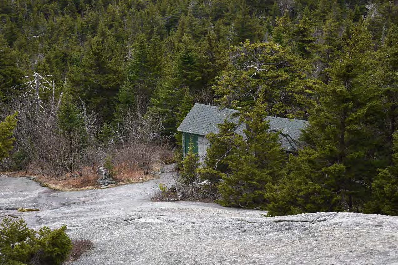 Mount Cardigan Fire Tower, Orange New Hampshire Watchman's Cabin from trail to summit, looking south (2022)