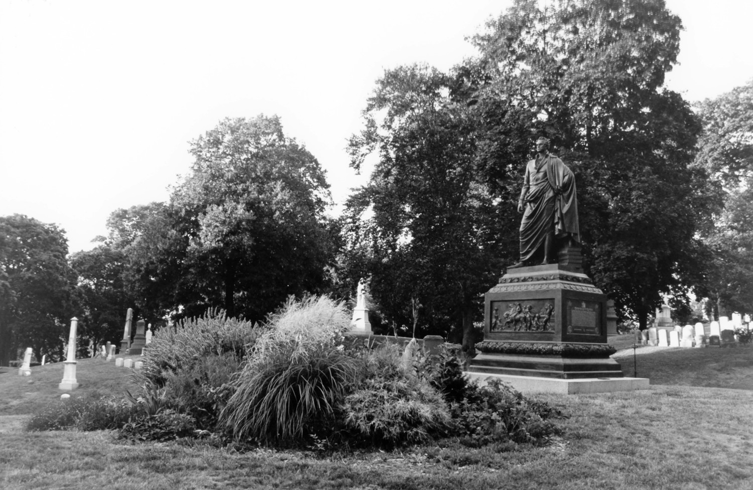 Green-Wood Cemetery-Greenwood, Brooklyn New York The De Witt Clinton Monument, showing granite pedestal with bronze sculpture by Henry Kirke Browne, and landscaped lot (2005)