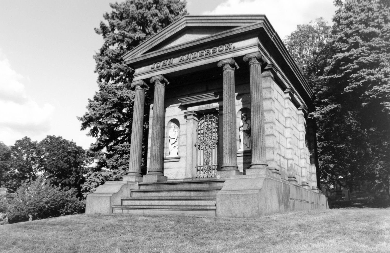 Green-Wood Cemetery-Greenwood, Brooklyn New York John Anderson's Greek Revival mausoleum at the intersection of Battle Avenue and Highland Avenue with sculpture by John Moffitt (2005)