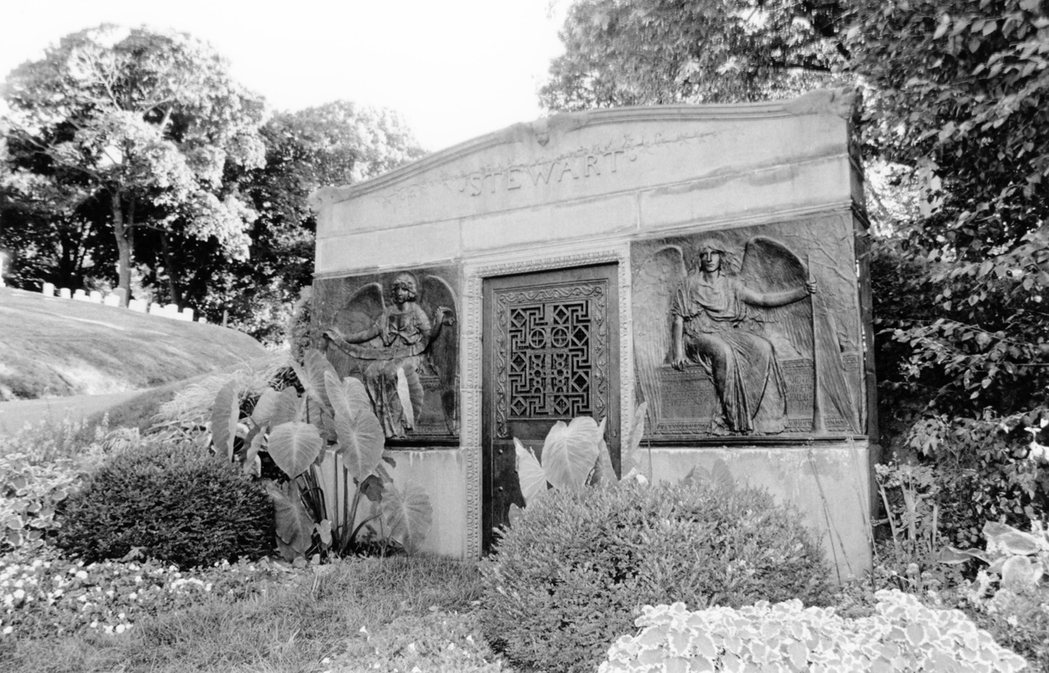 Green-Wood Cemetery-Greenwood, Brooklyn New York Stewart hillside [mausoleum] tomb by Stanford White with bronze panels by Augustus Saint-Gaudens, on Battle Avenue near the main entrance (2005)